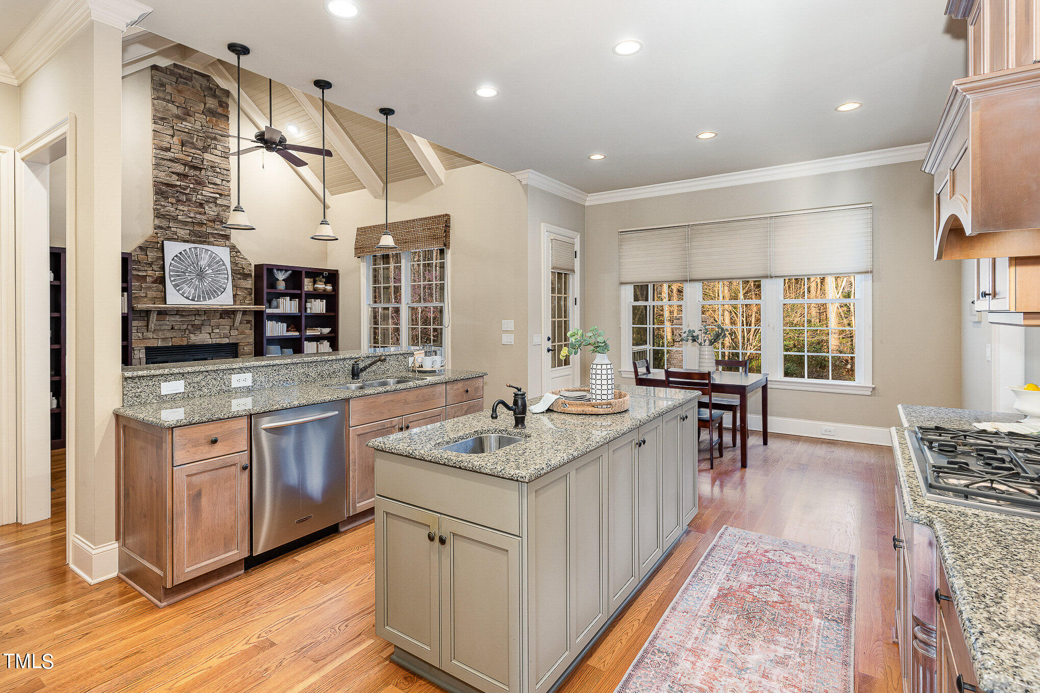 3028 Wyntree Ridge Way Raleigh, NC 27606 - Photo 30 of 39 a spacious kitchen with stainless steel appliances granite countertop a sink and a stove