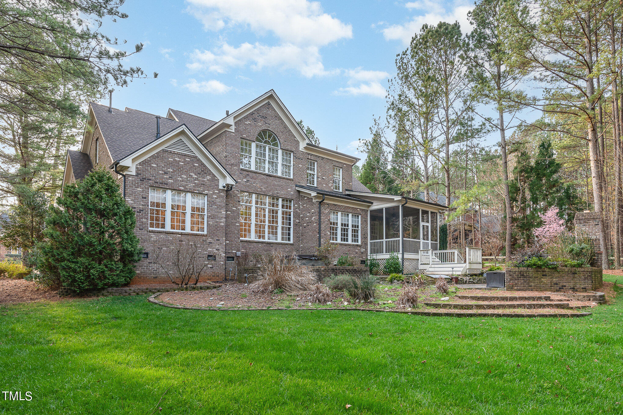 3028 Wyntree Ridge Way Raleigh, NC 27606 - Photo 37 of 39 a front view of a house with a garden and plants