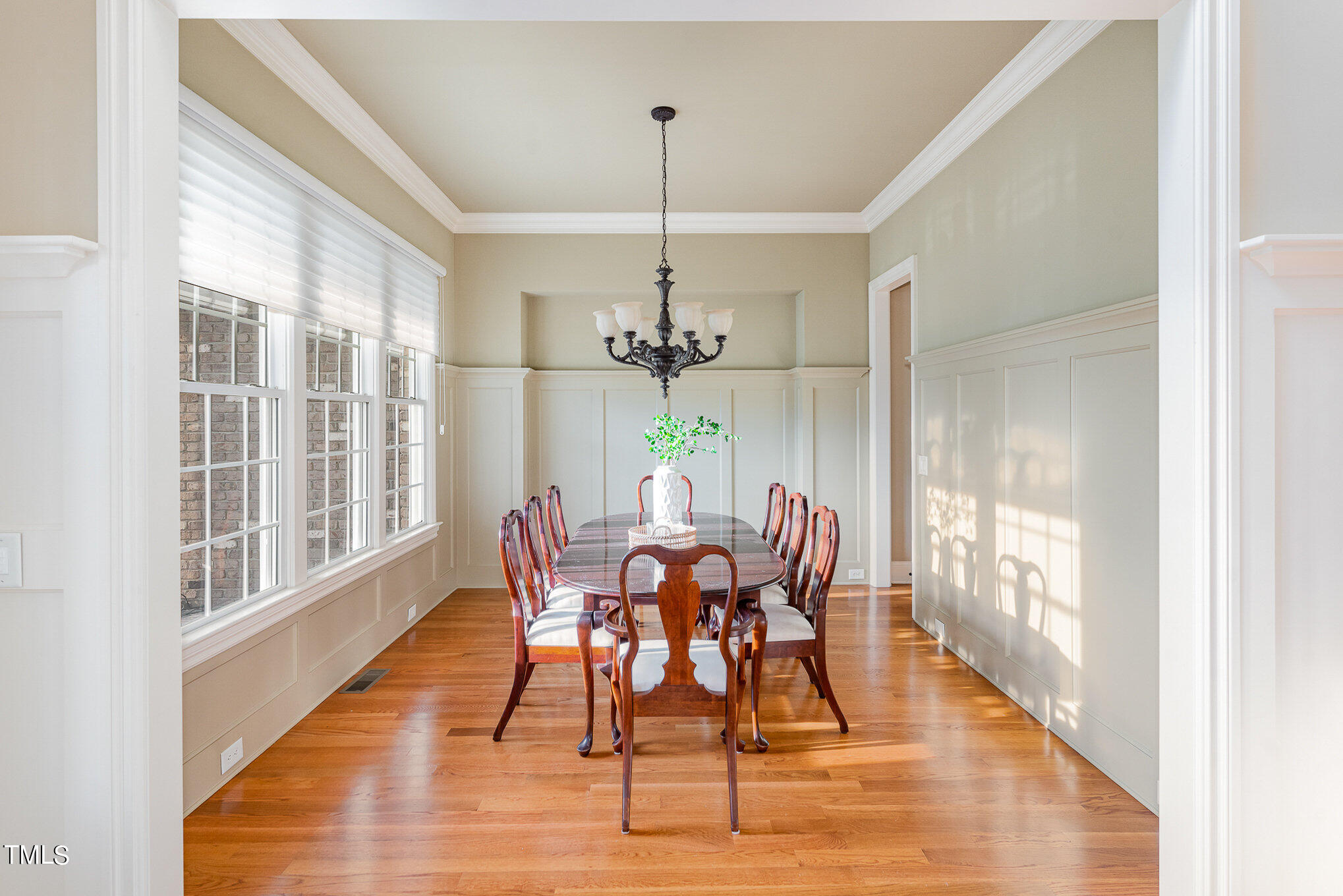 3028 Wyntree Ridge Way Raleigh, NC 27606 - Photo 6 of 39 a view of a dining room with furniture window and wooden floor