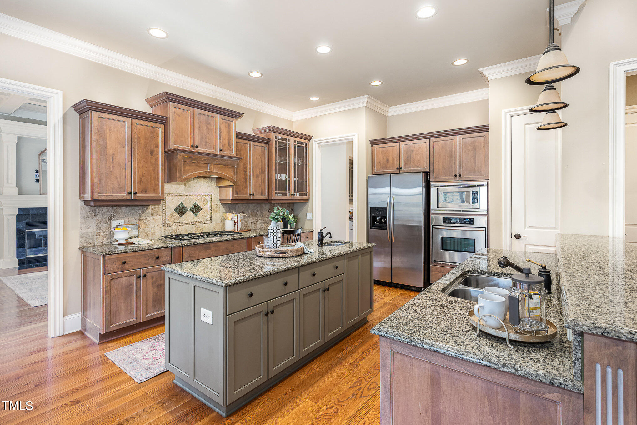 3028 Wyntree Ridge Way Raleigh, NC 27606 - Photo 8 of 39 a kitchen with stainless steel appliances granite countertop a sink stove and refrigerator