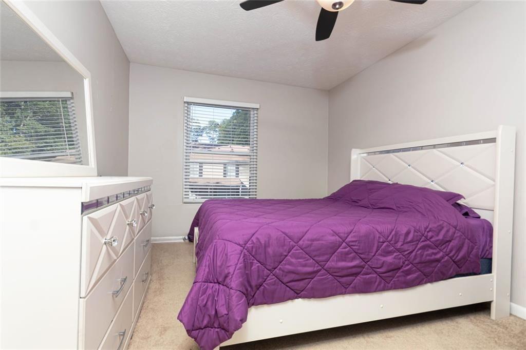 1348 Surrey Lane Southwest Marietta, GA 30008 - Photo 6 of 10 a bedroom with a bed and window