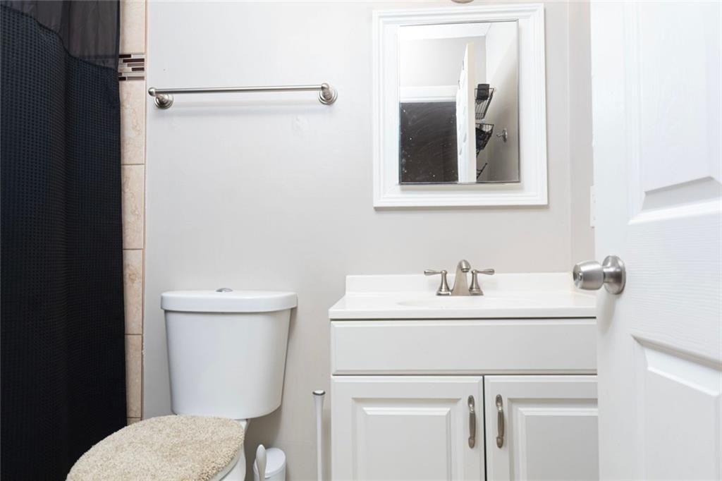 1348 Surrey Lane Southwest Marietta, GA 30008 - Photo 8 of 10 a bathroom with a sink and a toilet