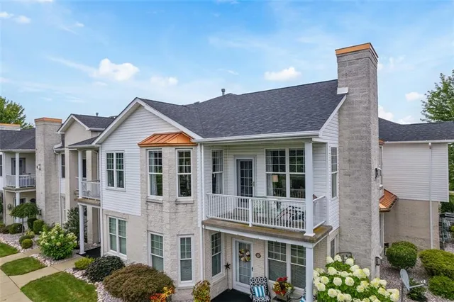 a front view of a residential houses with yard
