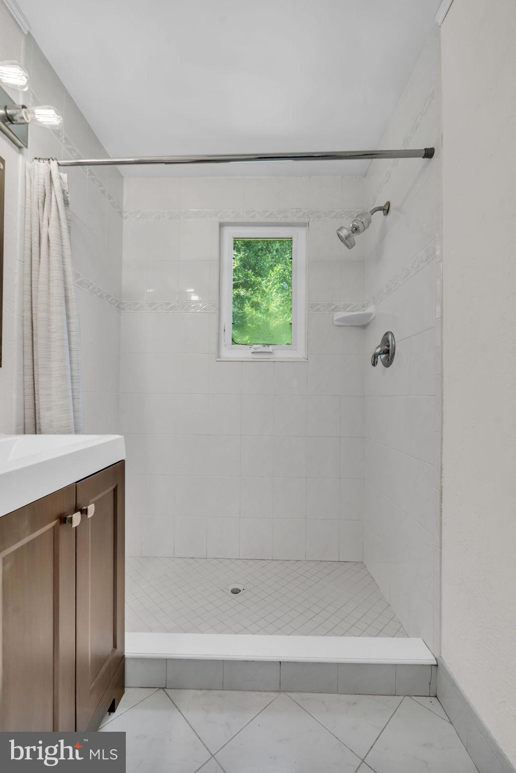 8106 Fort Hunt Road Alexandria, VA 22308 - Photo 34 of 34 Bright and airy shower oasis.