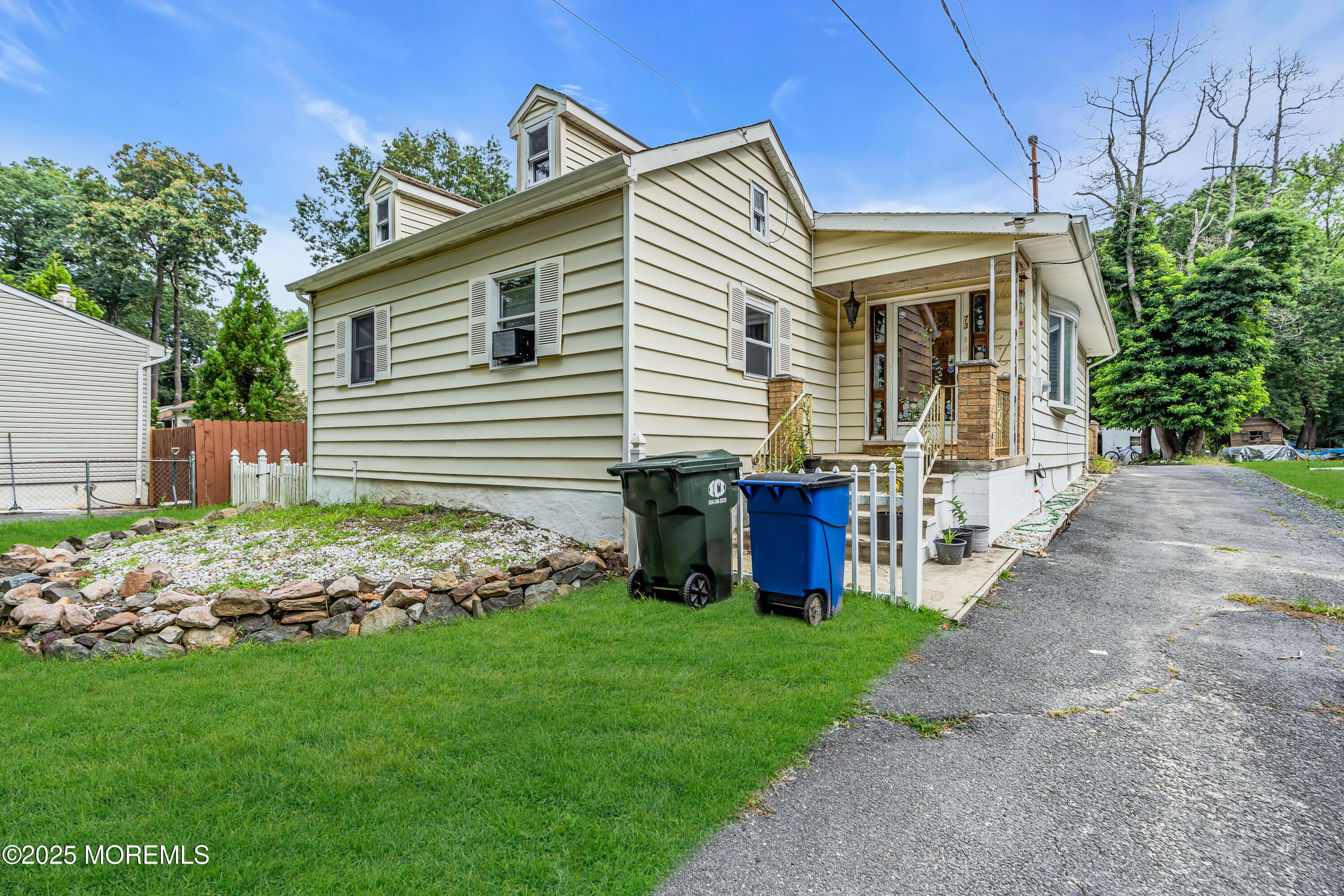 a front view of house with garden