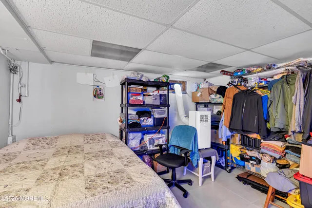 a bedroom with a bed and a table