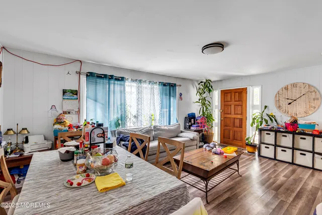 a living room with furniture fireplace and a window