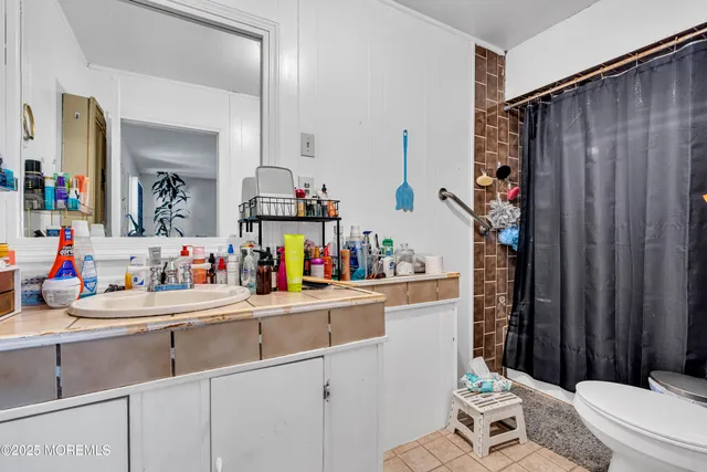 a bedroom with bed and a window