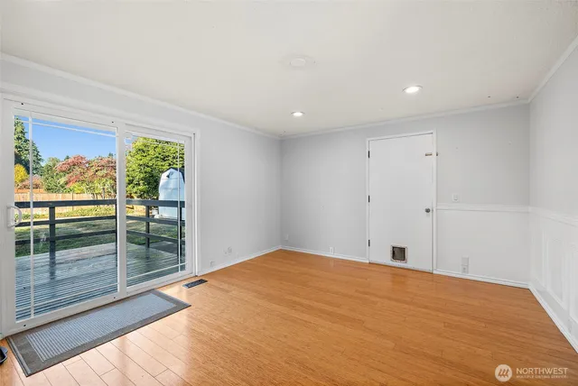 a bathroom with a granite countertop sink toilet and mirror
