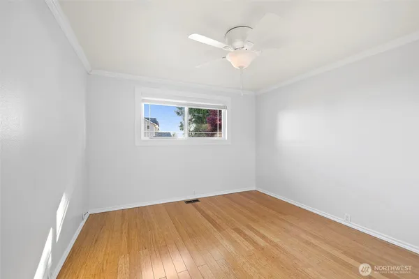 a bedroom with a bed and a table in it