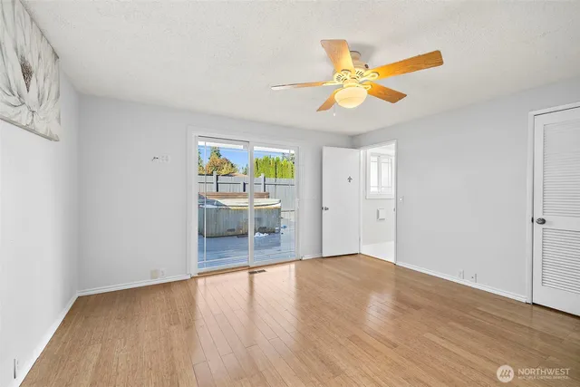 a bathroom with a sink a light fixture and a mirror