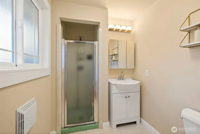 a view of a balcony with wooden floor and iron fence