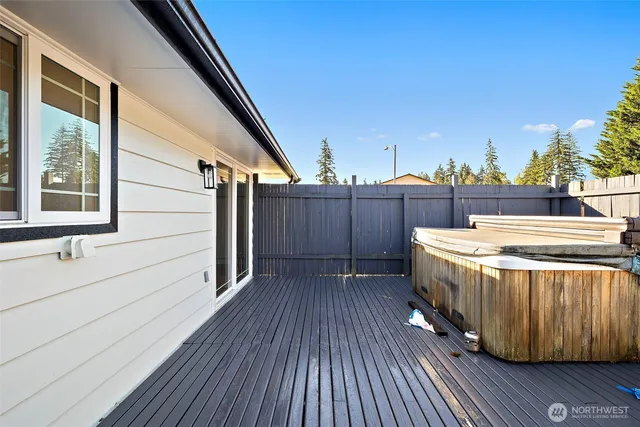 a view of swimming pool with a lounge chairs