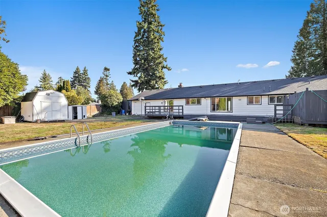 a view of a swimming pool with a patio