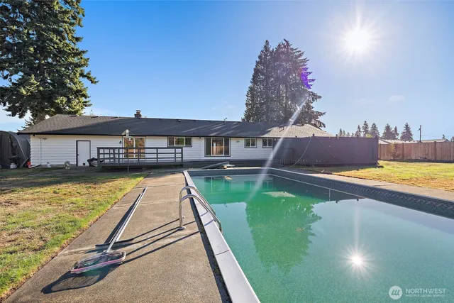 a view of a swimming pool and outdoor space