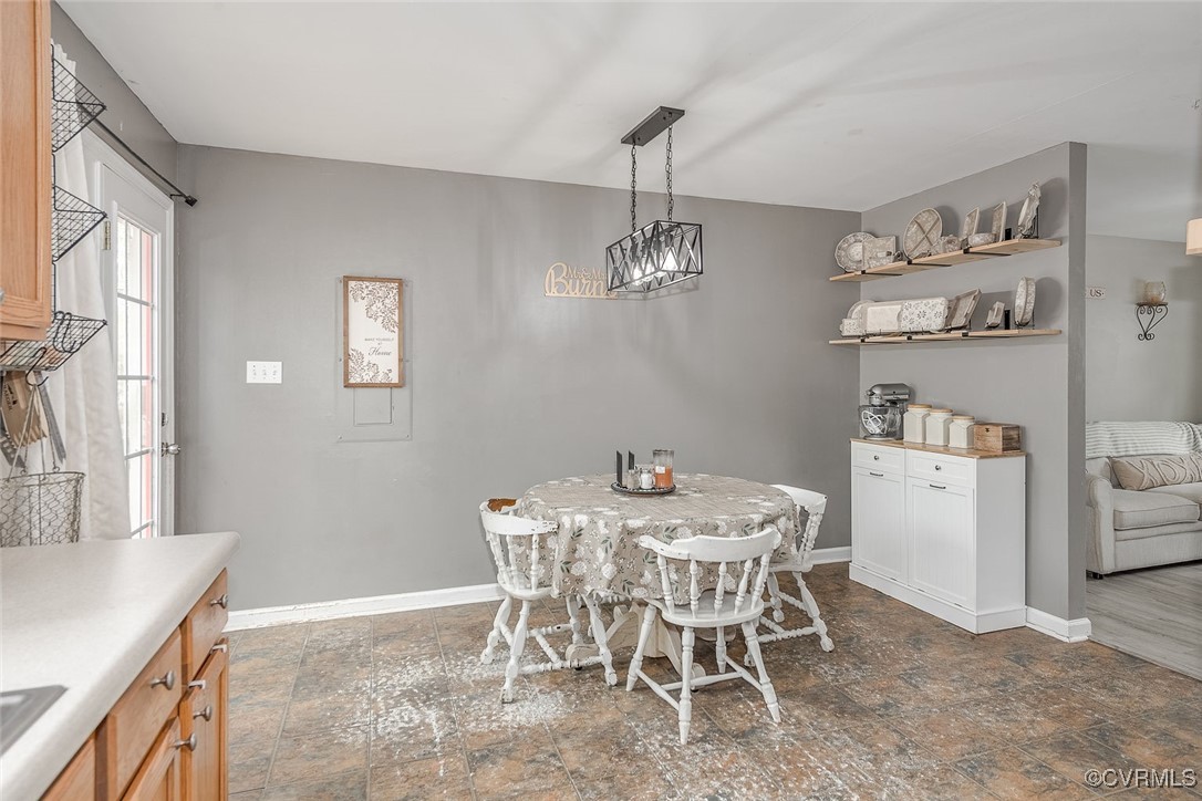 6330 Oak Drive Quinton, VA 23141 - Photo 11 of 23 a dining room with furniture and chandelier