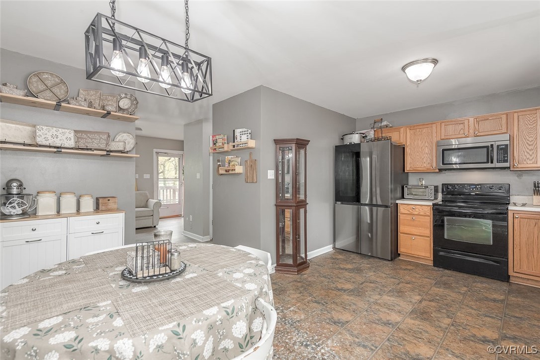 6330 Oak Drive Quinton, VA 23141 - Photo 12 of 23 a kitchen with stainless steel appliances a sink and a refrigerator