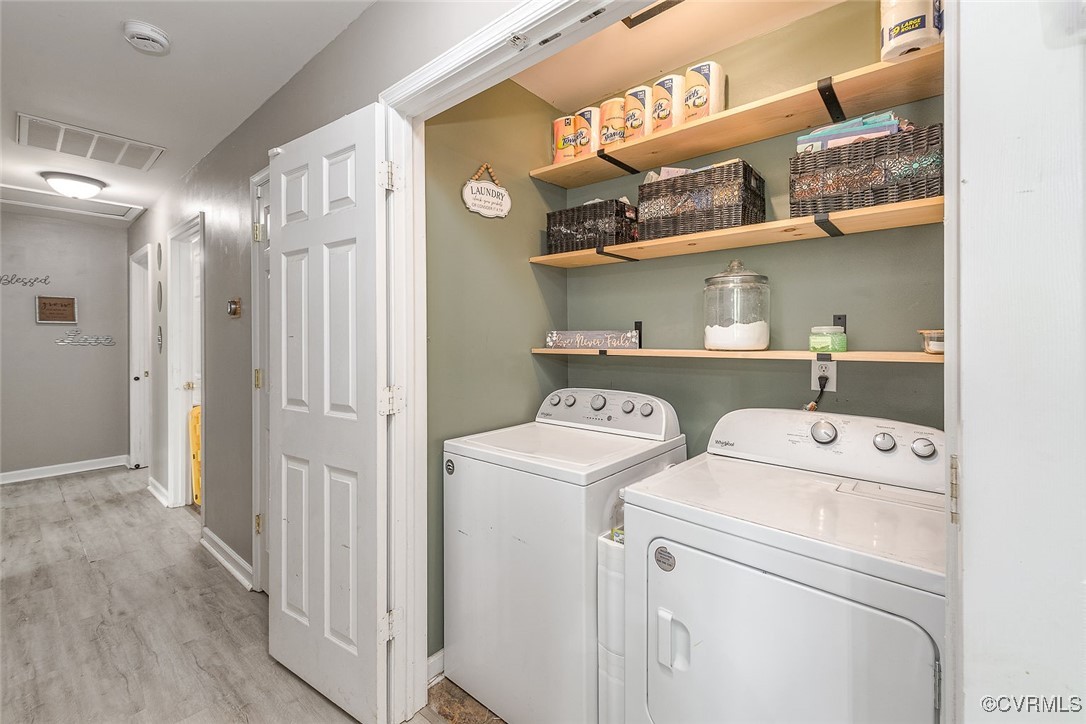 6330 Oak Drive Quinton, VA 23141 - Photo 13 of 23 a view of washer and dryer with wooden floor