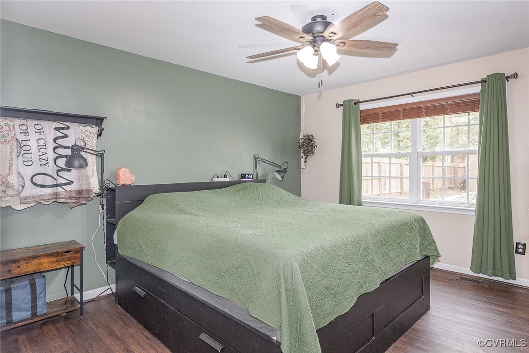 6330 Oak Drive Quinton, VA 23141 - Photo 14 of 23 a bedroom with a bed and a chandelier