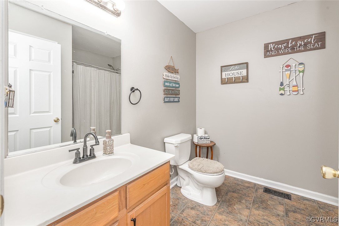 6330 Oak Drive Quinton, VA 23141 - Photo 18 of 23 a bathroom with a sink and a toilet