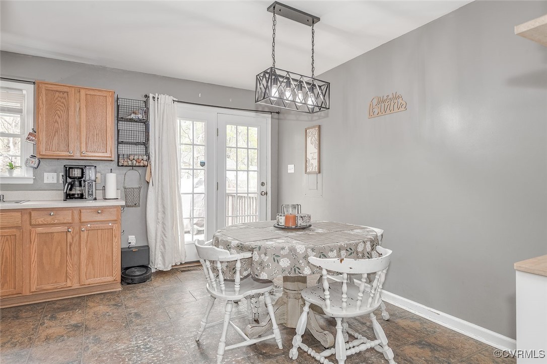 6330 Oak Drive Quinton, VA 23141 - Photo 7 of 23 a view of a dining room with furniture window and outside view