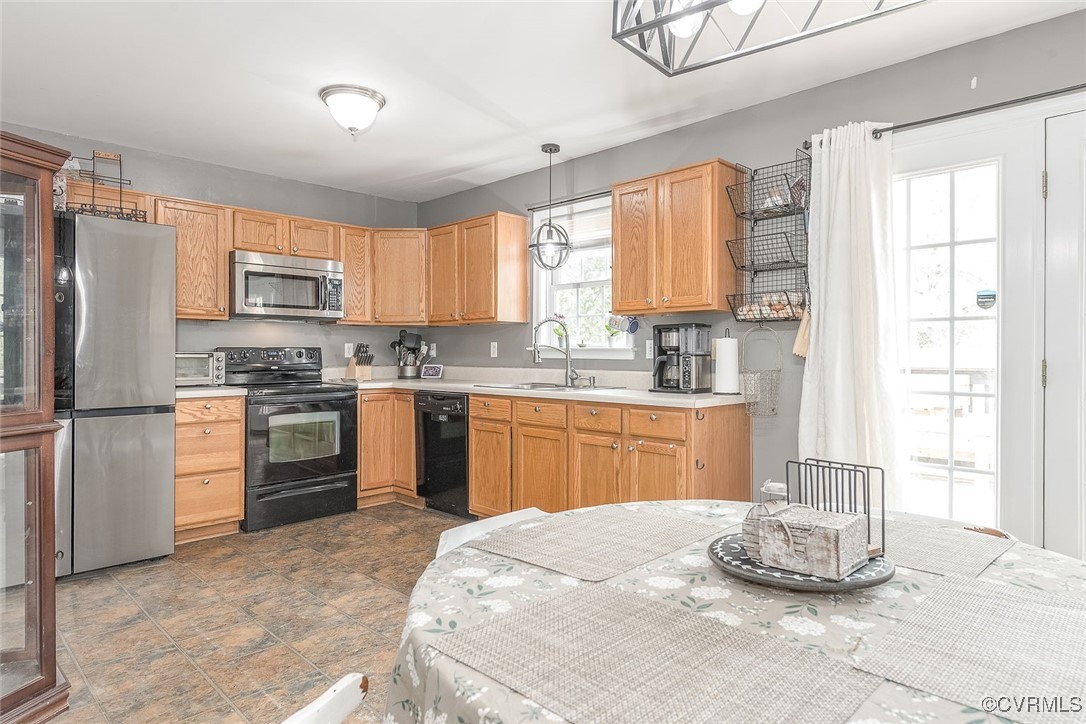 6330 Oak Drive Quinton, VA 23141 - Photo 8 of 23 a kitchen with granite countertop a stove a sink dishwasher a refrigerator and a microwave