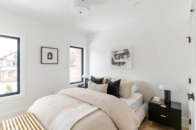 a bedroom with bed and a window