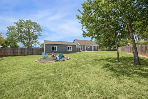 a front view of house with yard and seating area