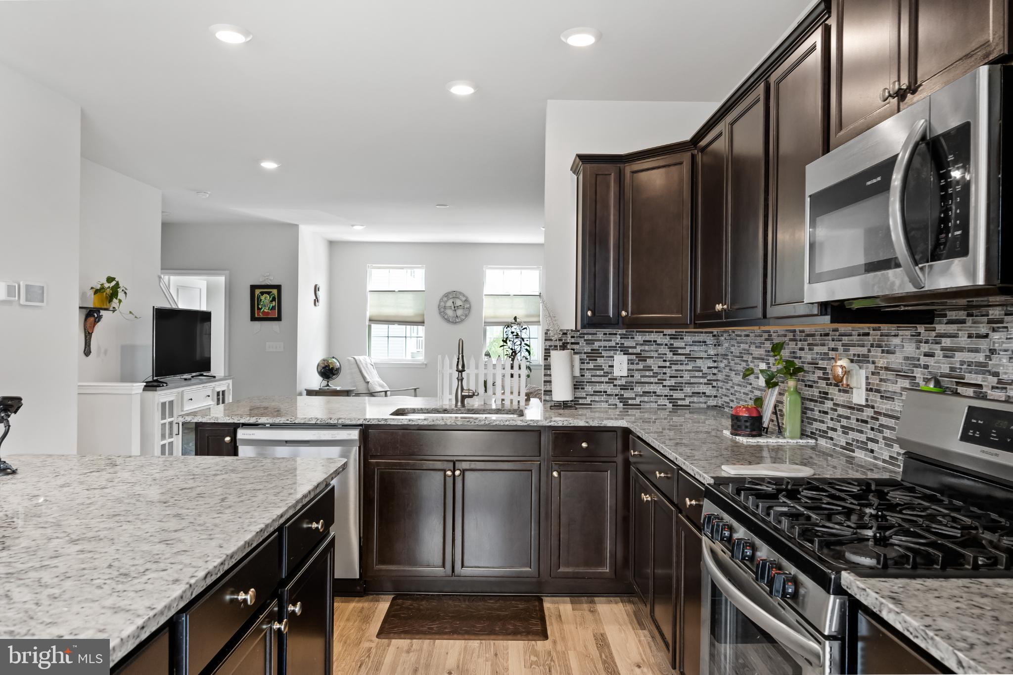 6 Rome Way Mount Laurel, NJ 08054 - Photo 14 of 28 a kitchen with stainless steel appliances granite countertop a sink stove and cabinets