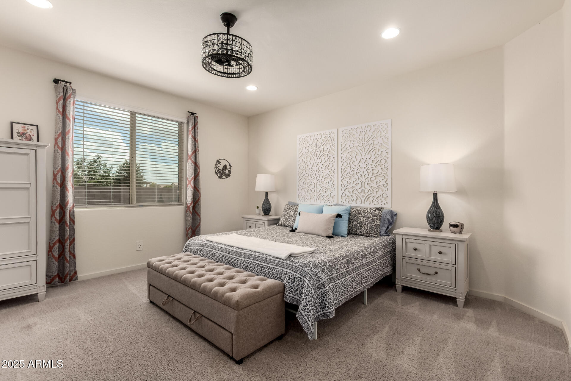 20485 North Candlelight Road Maricopa, AZ 85138 - Photo 13 of 26 a bedroom with a bed and a window