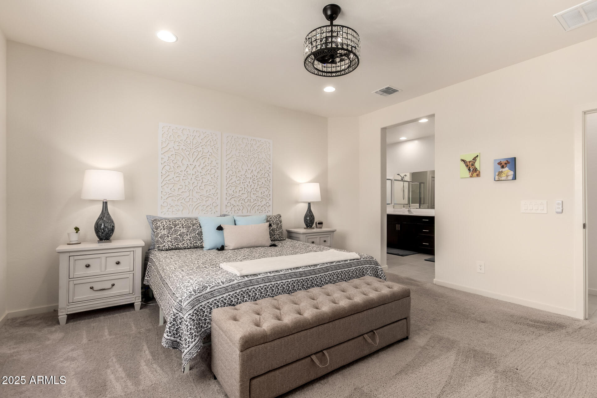 20485 North Candlelight Road Maricopa, AZ 85138 - Photo 15 of 26 a spacious bedroom with a bed and a chandelier