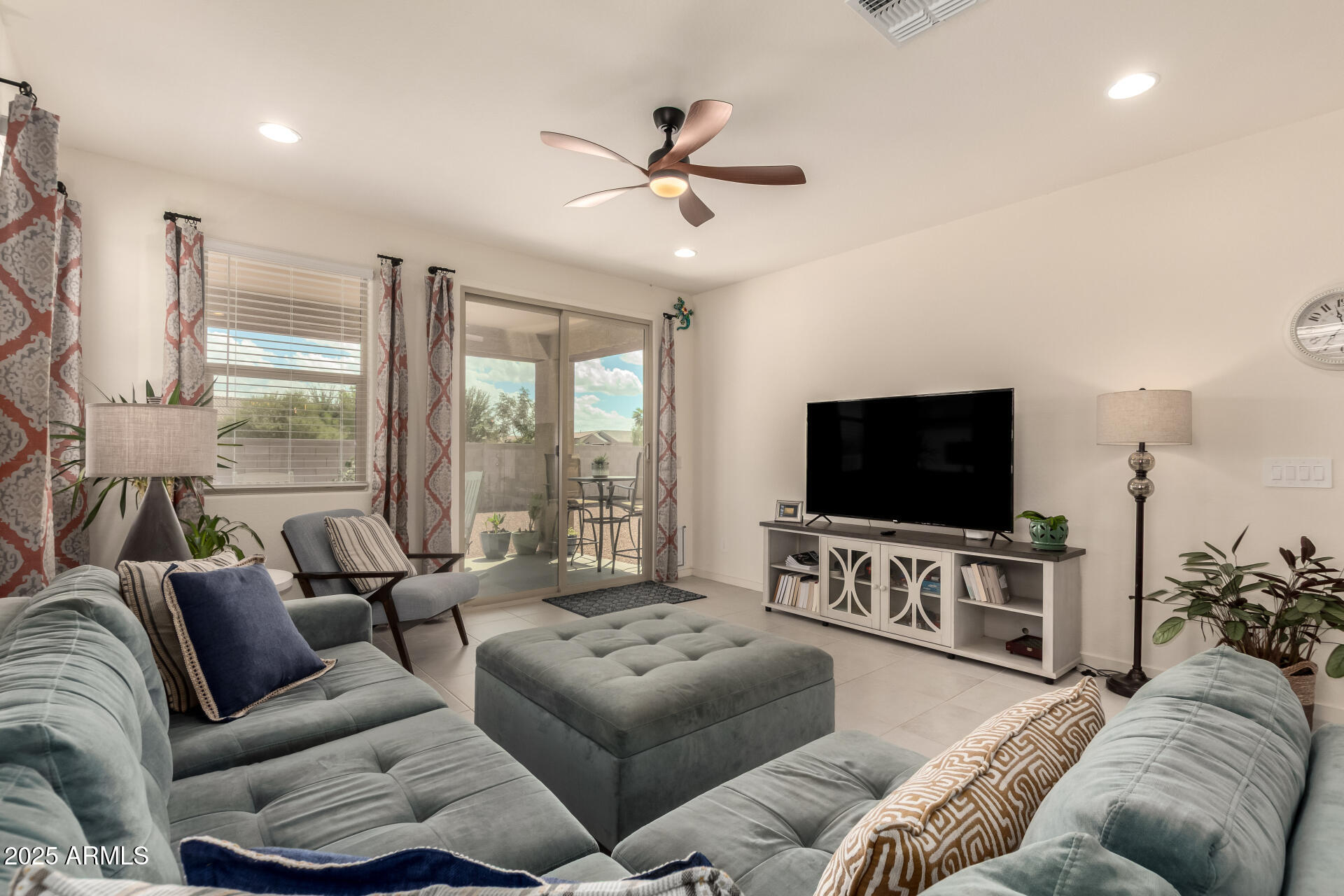 20485 North Candlelight Road Maricopa, AZ 85138 - Photo 6 of 26 a living room with furniture and a flat screen tv