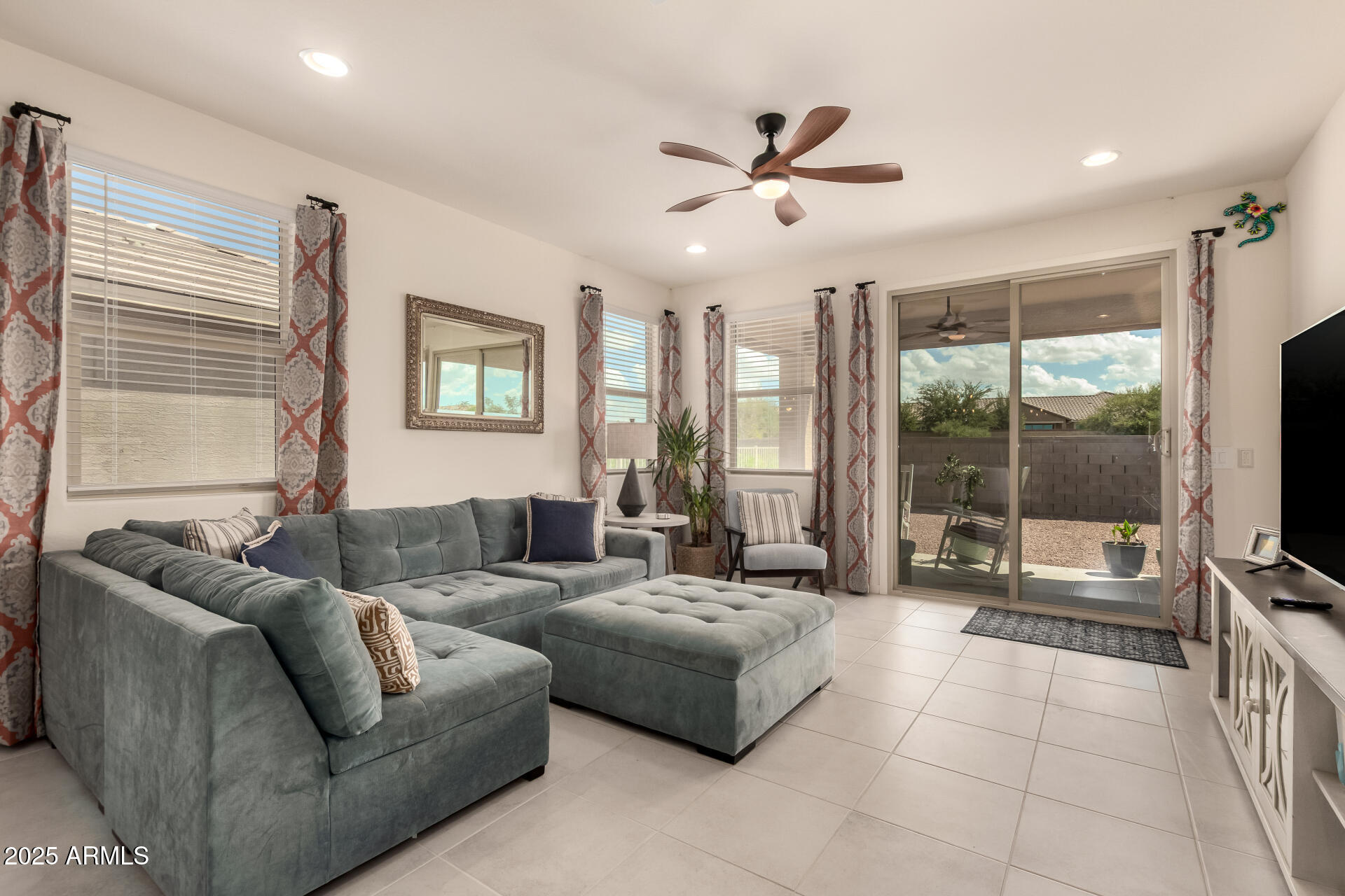20485 North Candlelight Road Maricopa, AZ 85138 - Photo 7 of 26 a living room with furniture and a flat screen tv