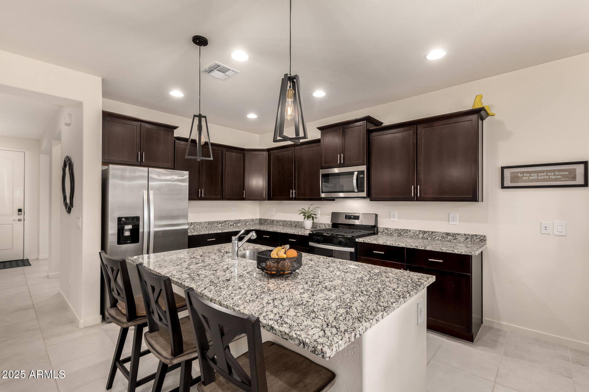 20485 North Candlelight Road Maricopa, AZ 85138 - Photo 10 of 26 a kitchen with cabinets and stainless steel appliances