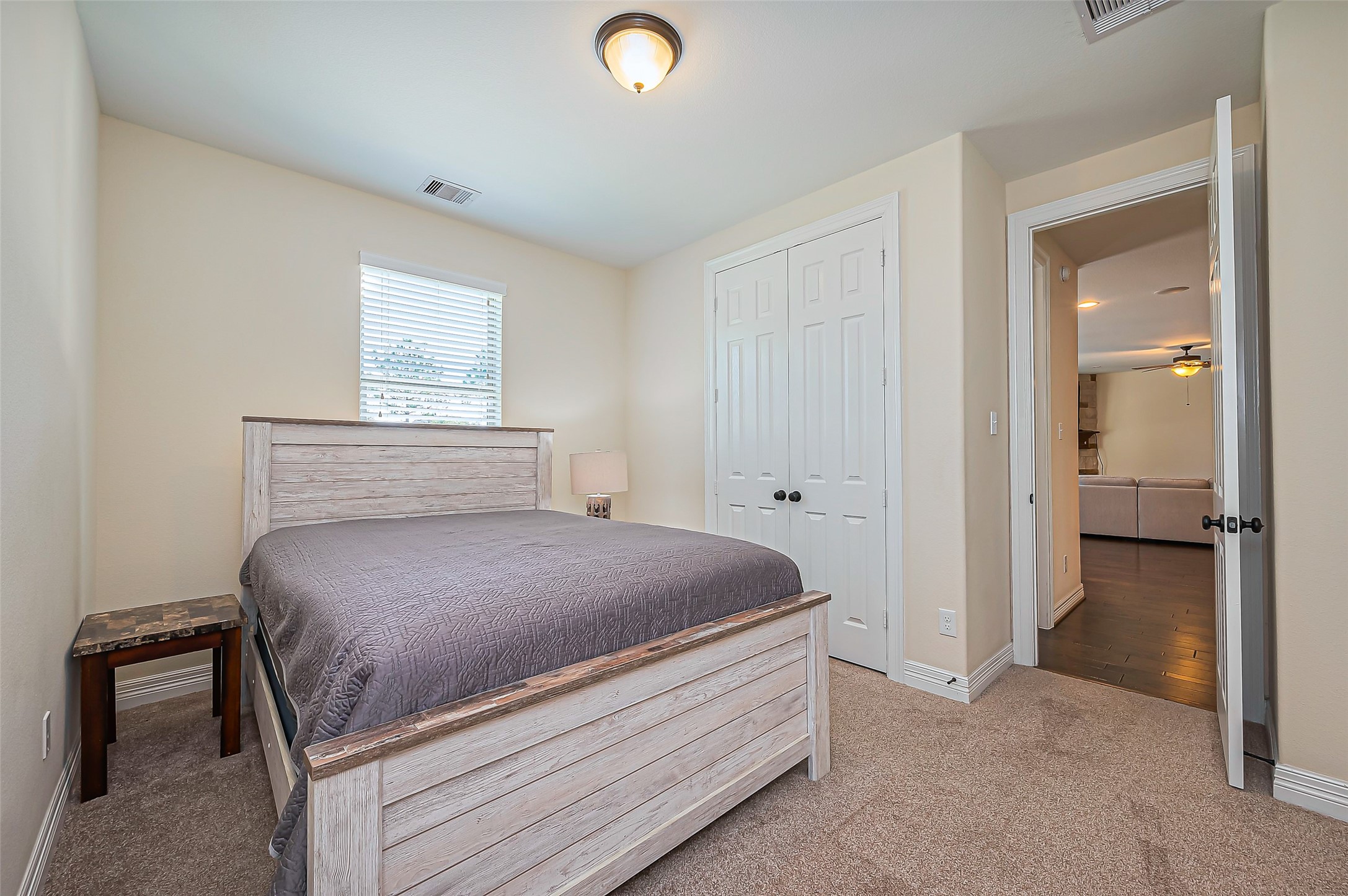10018 Durango Path Lane Cypress, TX 77433 - Photo 20 of 50 Cozy secondary bedroom with ample closet space and natural light. Perfect for guests or a home office.