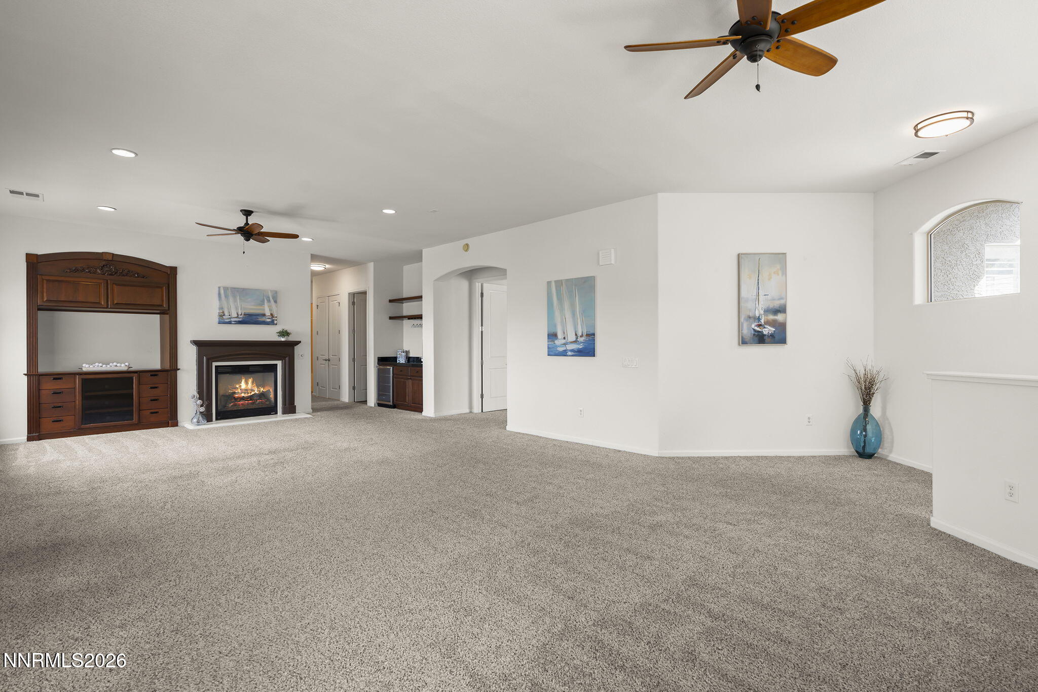 9900 Wilbur May Parkway, Unit 304 Reno, NV 89521 - Photo 6 of 47 a view of a livingroom with a fireplace cabinet and windows
