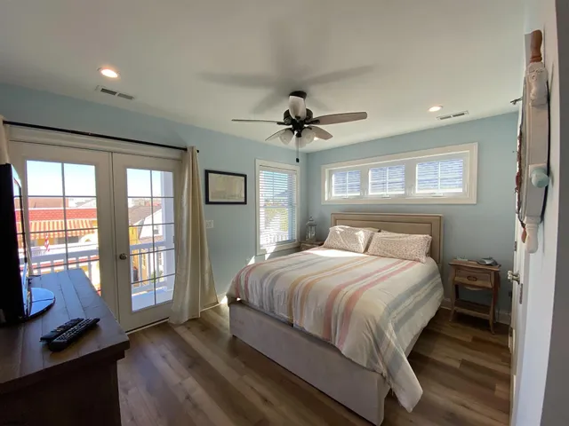 a bedroom with a large bed and a tv