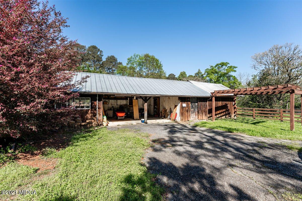 7798 Zebulon Road Macon, GA 31220 - Photo 27 of 35 a front view of a house with a yard