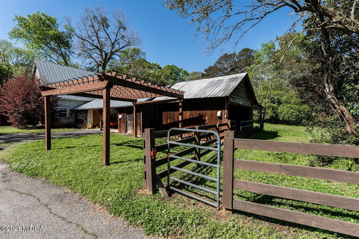 7798 Zebulon Road Macon, GA 31220 - Photo 29 of 35 a front view of a house with porch