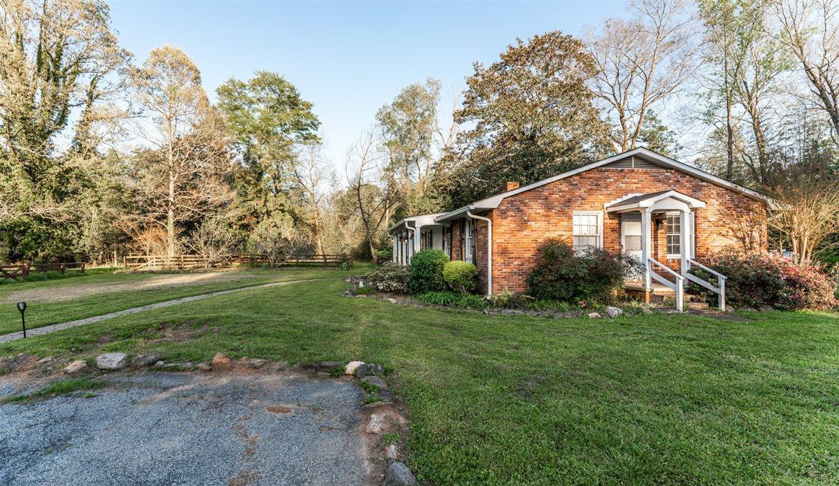 7798 Zebulon Road Macon, GA 31220 - Photo 35 of 35 a front view of a house with a yard