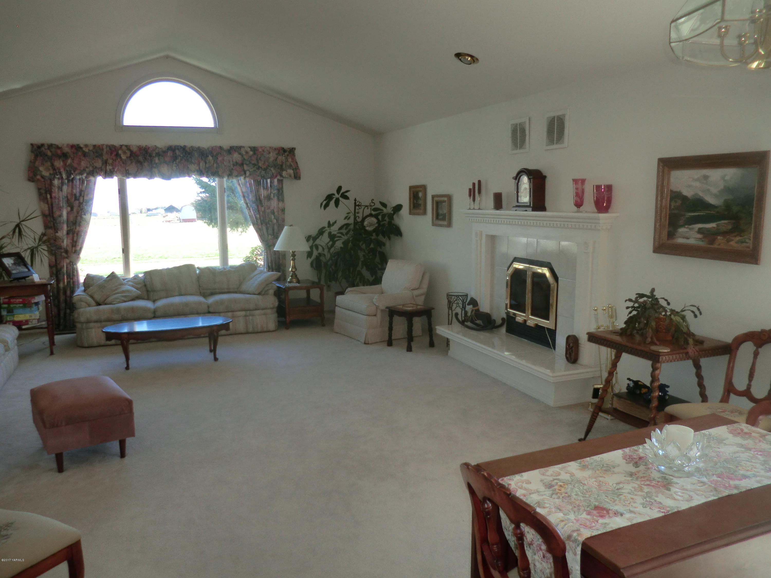 14721 Fisk Road Yakima, WA 98908 - Photo 10 of 20 a living room with furniture and a fireplace