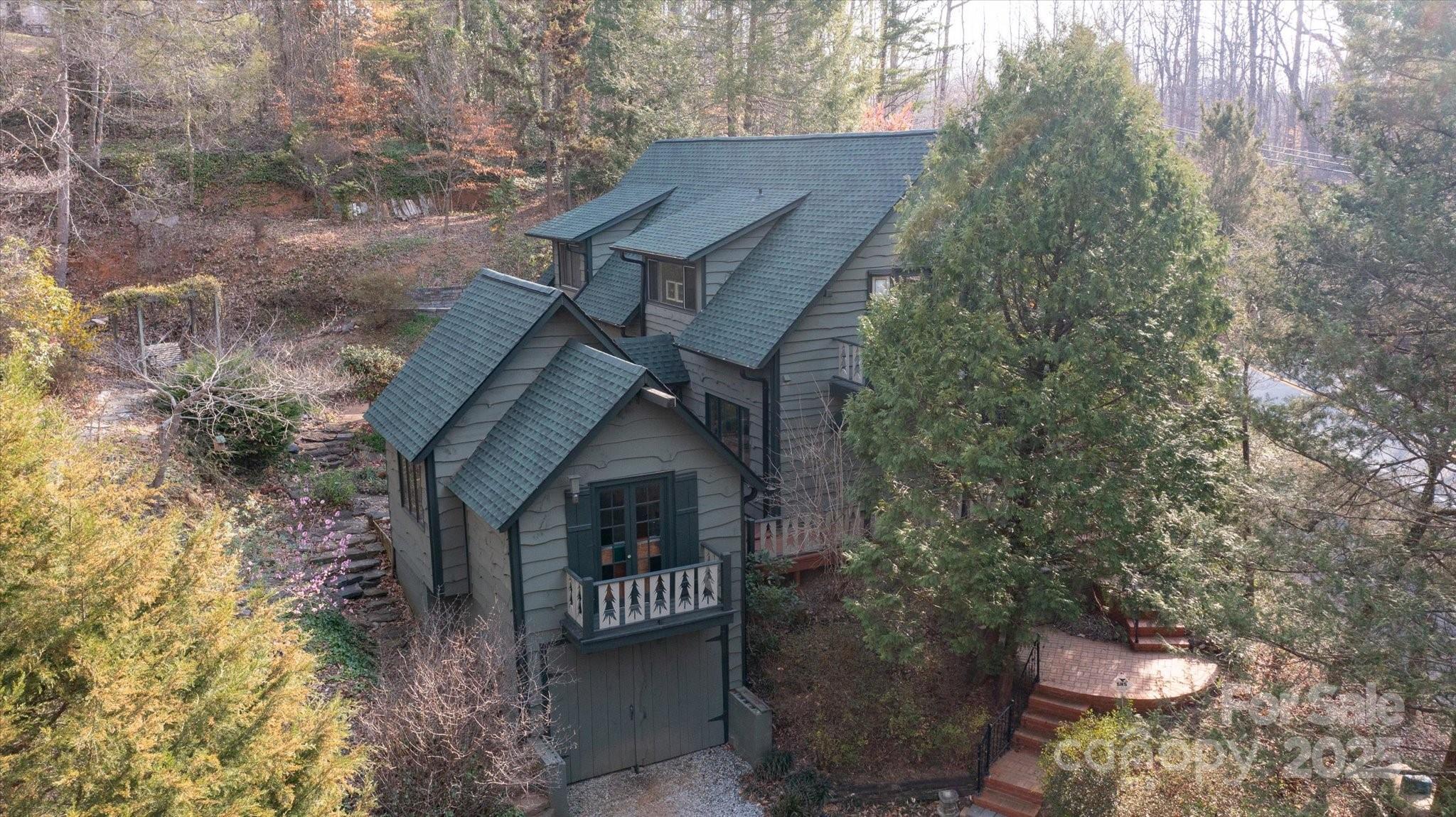 1506 Lynn Road Columbus, NC 28722 - Photo 1 of 30 a front view of a house with garden
