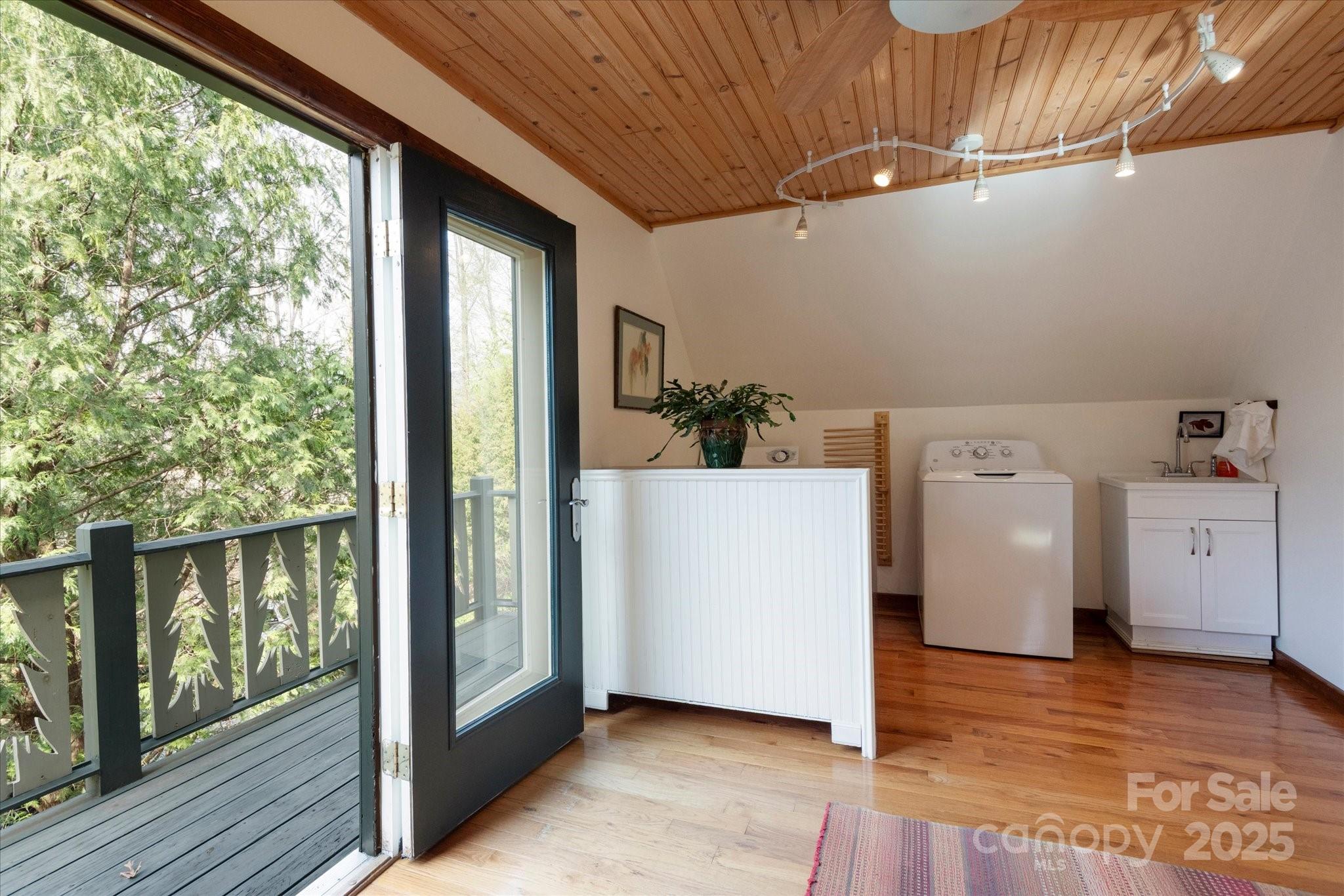1506 Lynn Road Columbus, NC 28722 - Photo 13 of 30 a view of a storage & utility room with washer and dryer