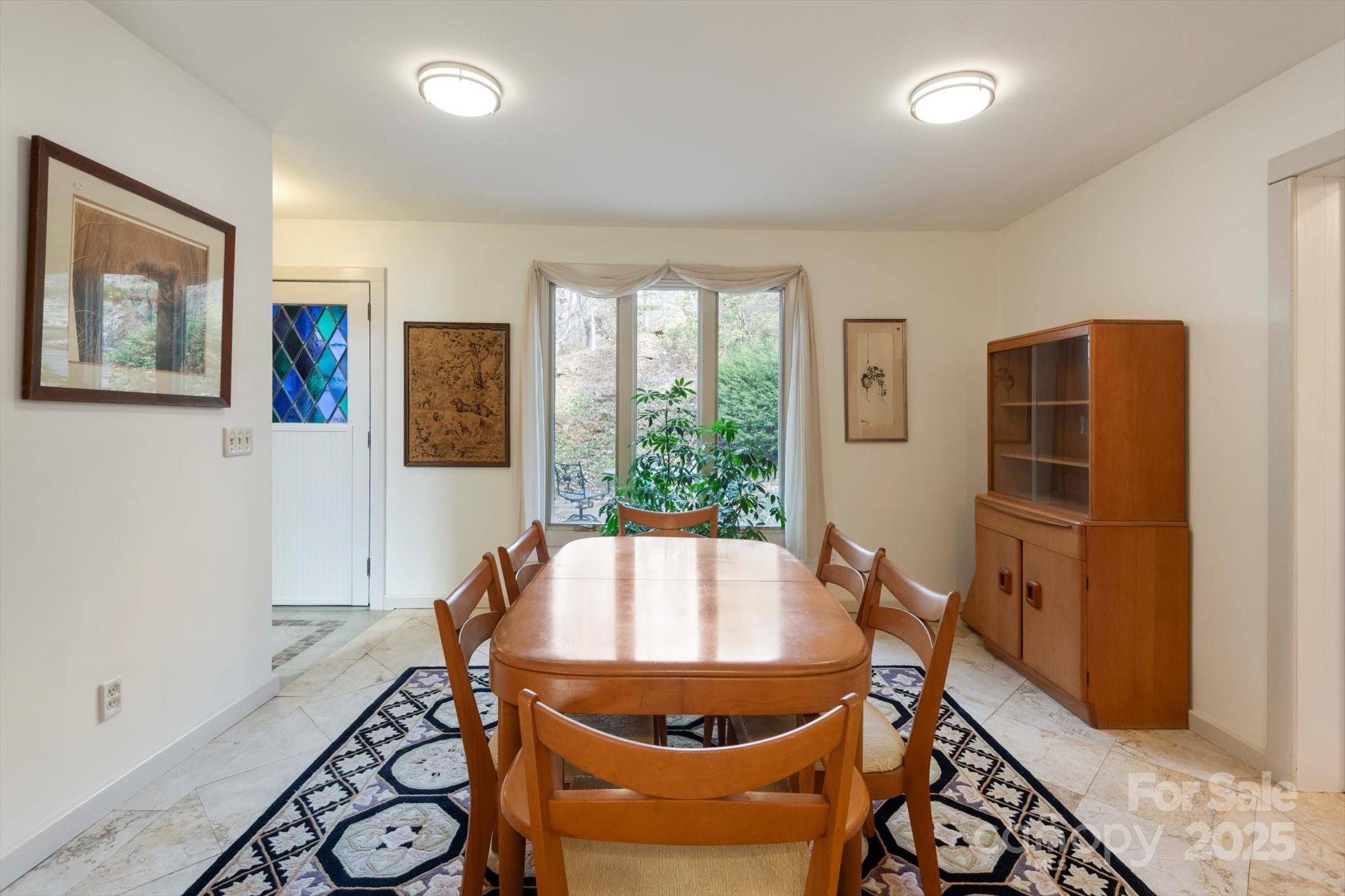 1506 Lynn Road Columbus, NC 28722 - Photo 20 of 30 a room with wooden floor and windows