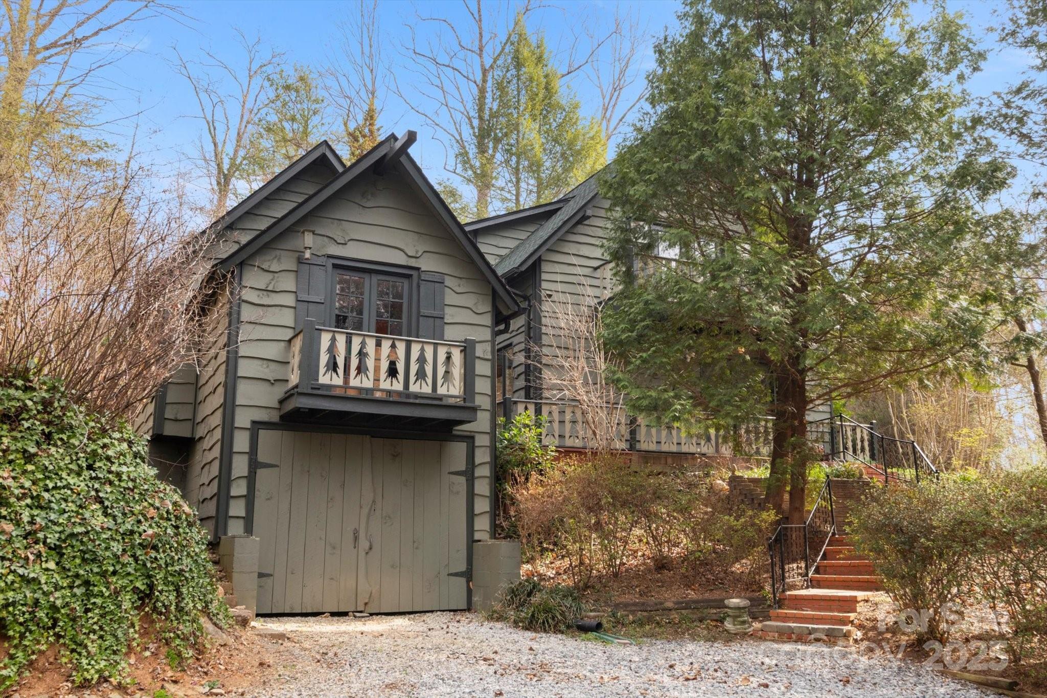 1506 Lynn Road Columbus, NC 28722 - Photo 22 of 30 a front view of a house with garden