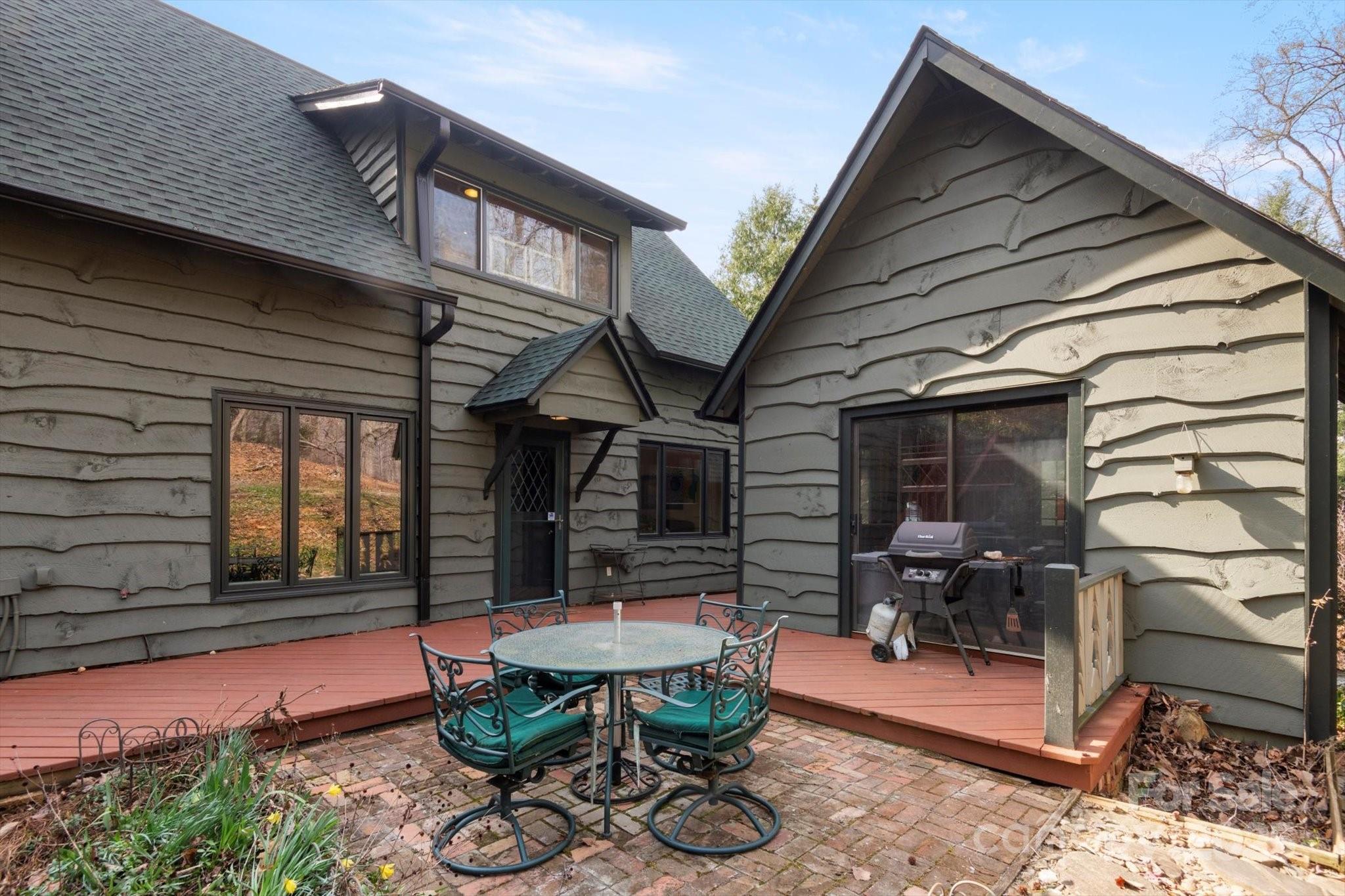 1506 Lynn Road Columbus, NC 28722 - Photo 25 of 30 a backyard of a house with table and chairs