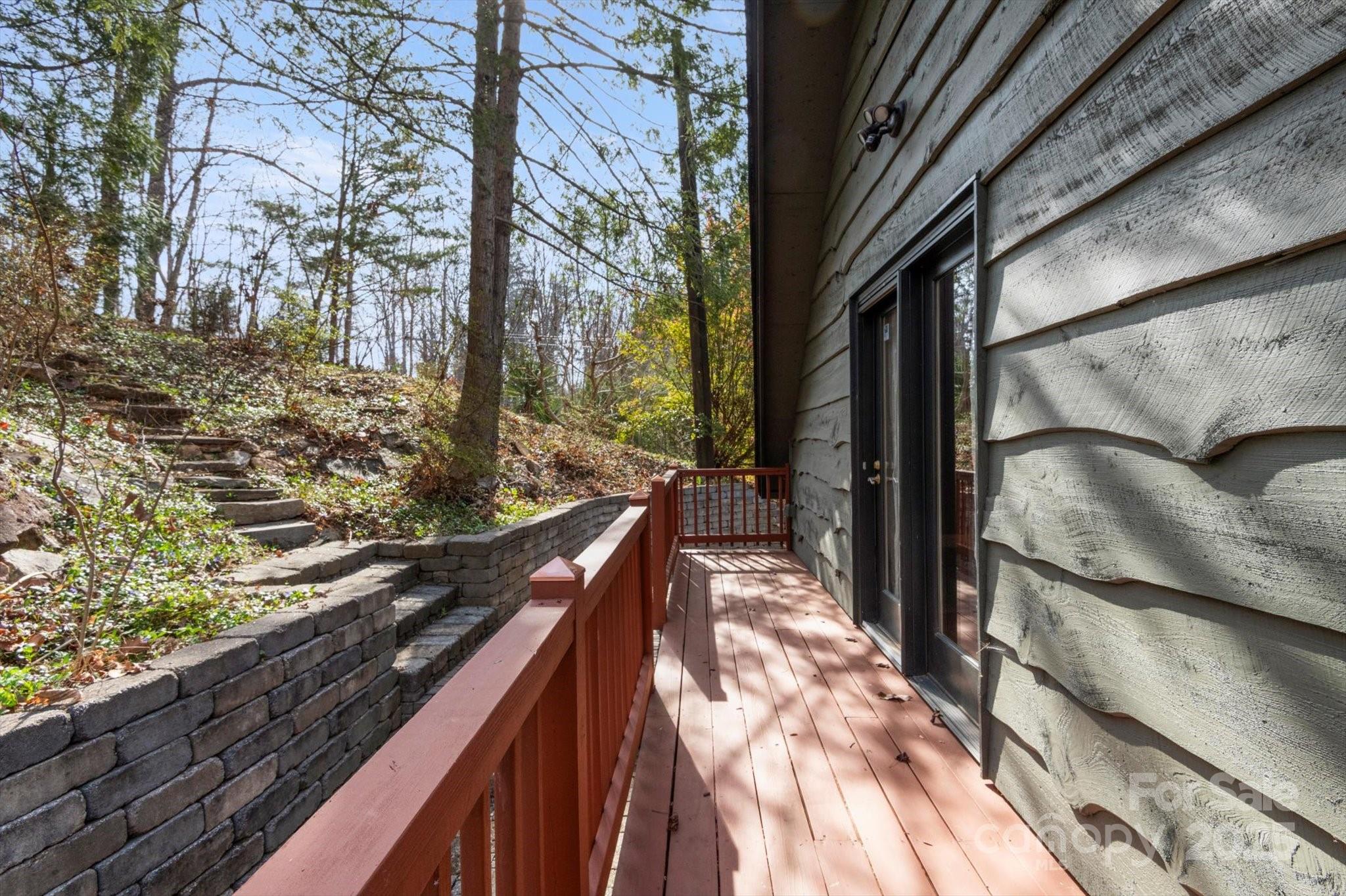 1506 Lynn Road Columbus, NC 28722 - Photo 5 of 30 a view of balcony with wooden floor and fence