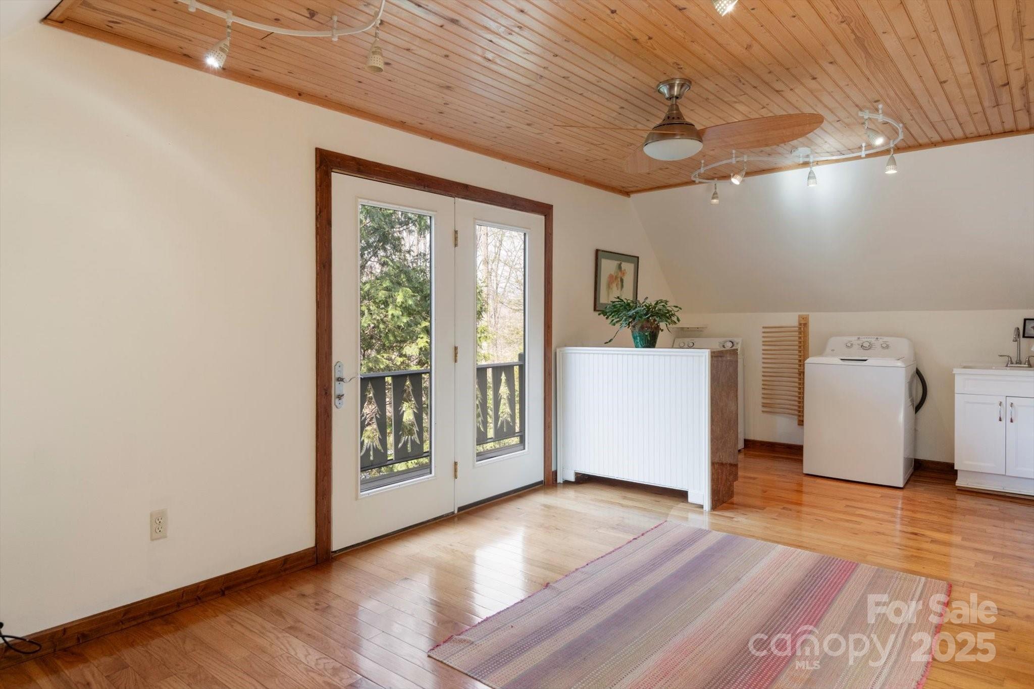 1506 Lynn Road Columbus, NC 28722 - Photo 6 of 30 a view of a big room with wooden floor and windows