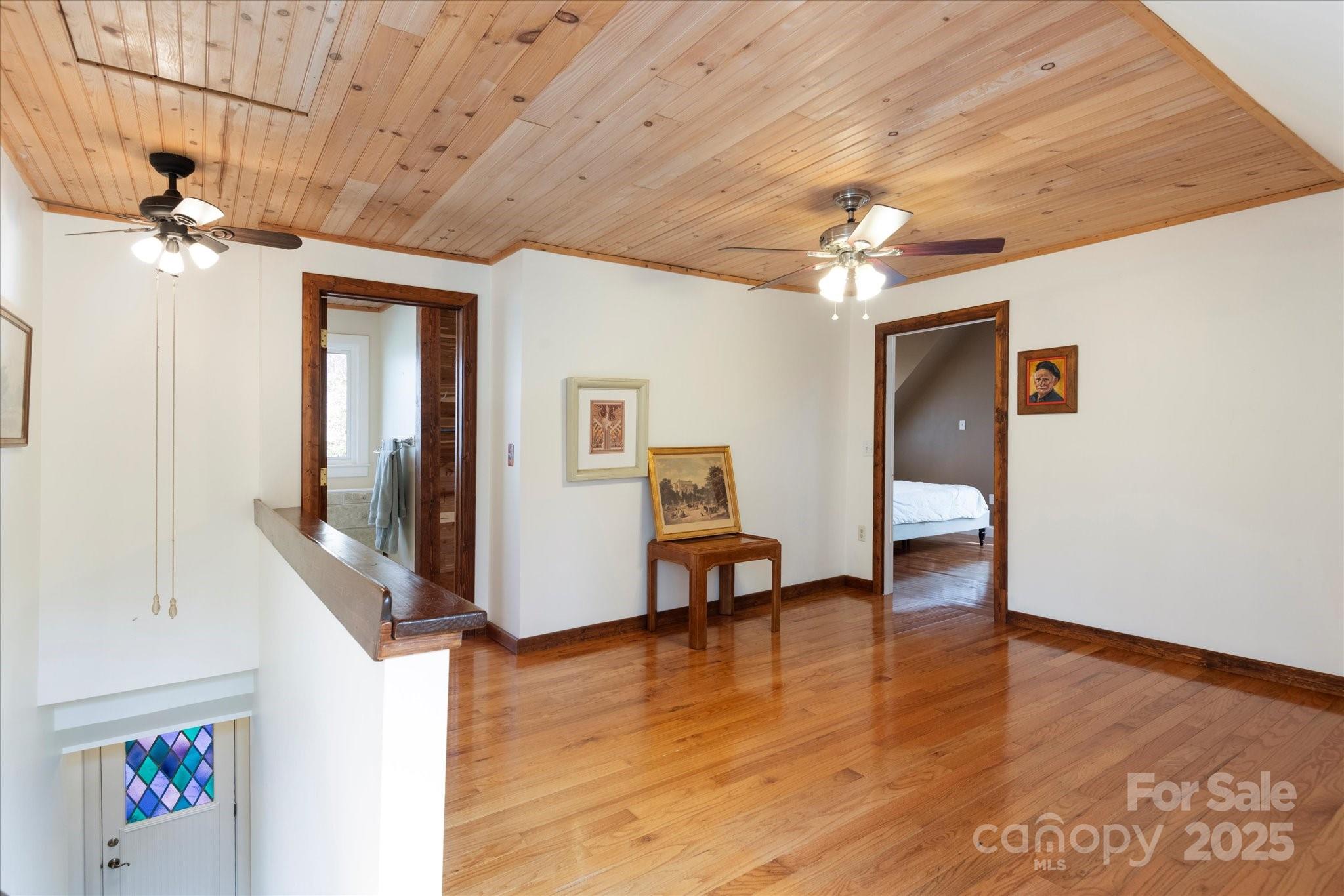 1506 Lynn Road Columbus, NC 28722 - Photo 7 of 30 a view of a livingroom with furniture and a ceiling fan