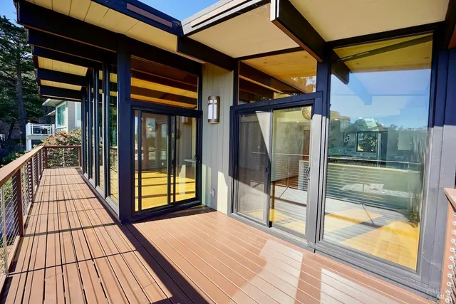 a view of a balcony with dining area
